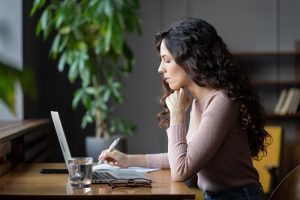 women researching on laptop